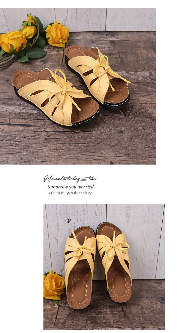 Sandalias de cuña plana con lazo calado